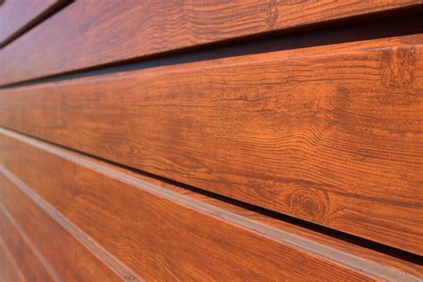 sheet metal that looks like wood|textured metal exterior siding.